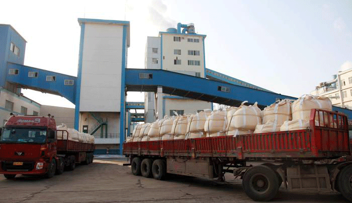 Soda ash factory and loaded trucks