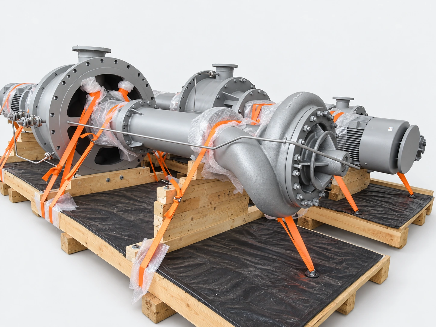 Pump assemblies secured with orange straps for transport.